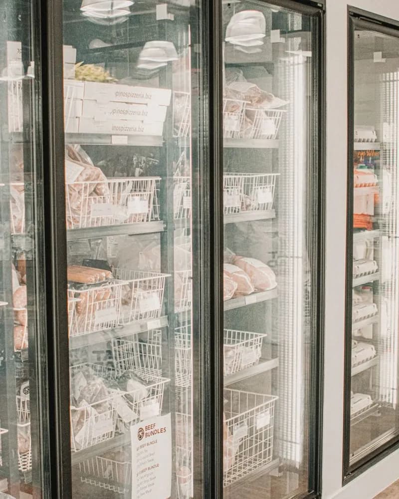 Glass-door commercial coolers stocked with packaged food