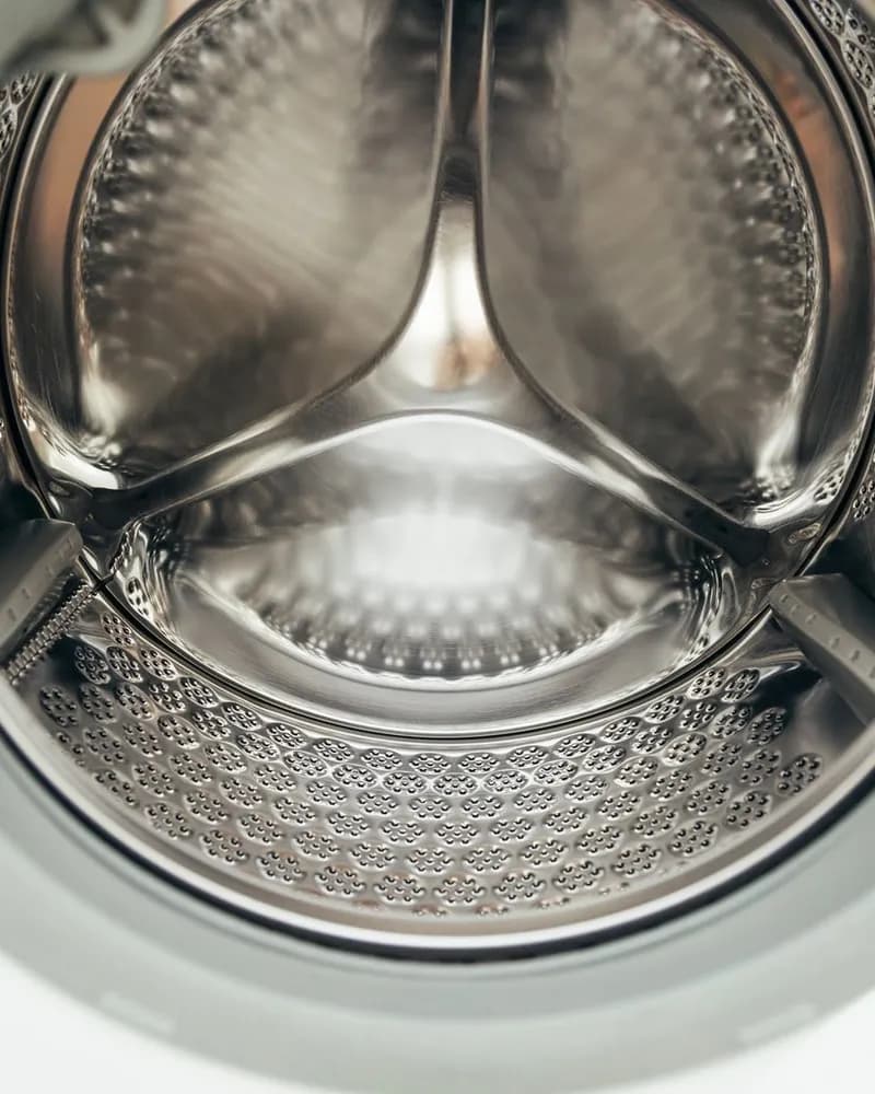 Close-up of a stainless steel washing machine drum